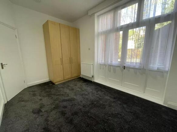 Bright spacious room with large windows...