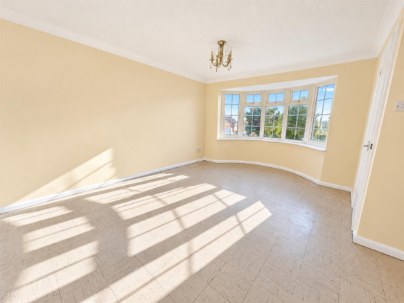 Sunlit Empty Bay Window Room.png
