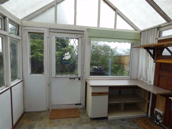 DATED WOODEN CONSERVATORY
