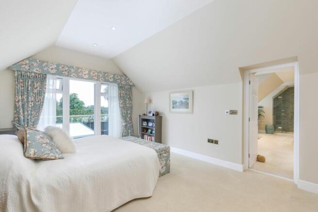 Principle bedroom with vaulted ceiling