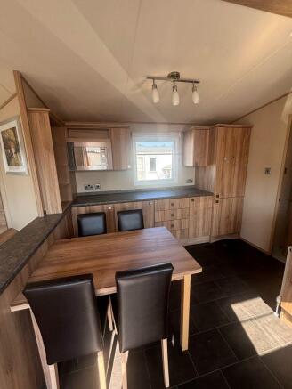 Dining Area And Extensive Kitchen Storage Inside T
