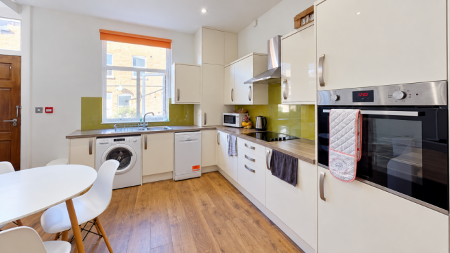 Bright Modern Kitchen with Green Backsplash