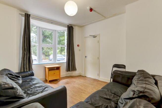 Bright and inviting living room featuring ample...