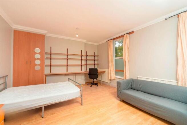 Bright, furnished bedroom with study area...