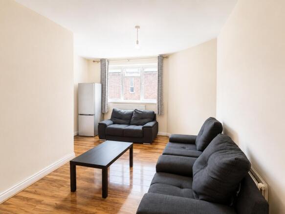 Bright lounge with comfy sofas and wood floors...