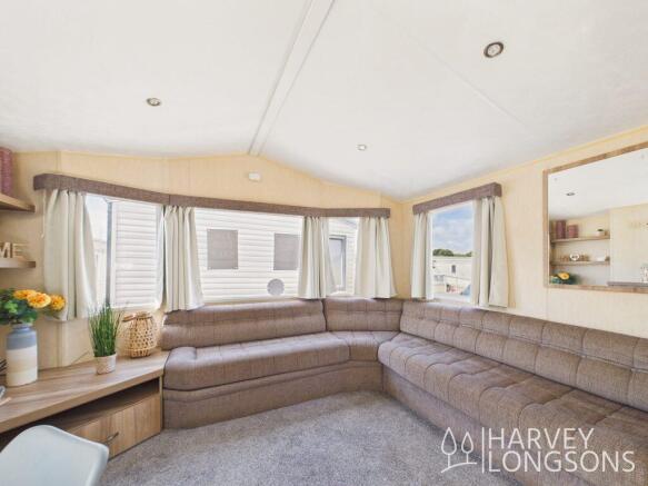 Bright lounge with large L-shaped corner sofa