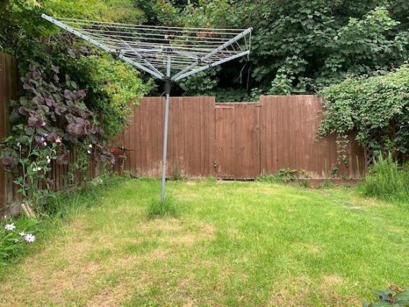 Private rear garden with lawn and rotary dryer...