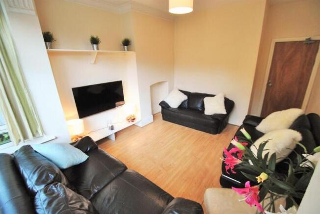 Spacious living room with comfortable sofas and...