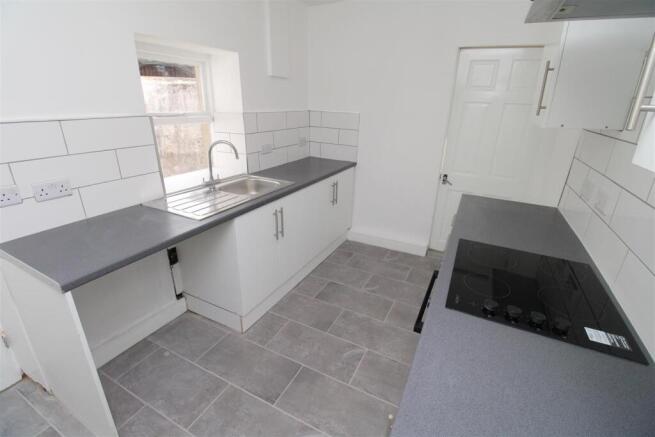 Bright modern kitchen with sleek tiling...