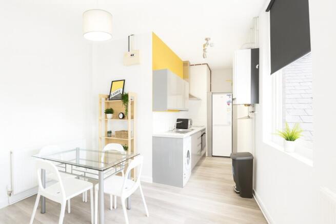 Bright and modern kitchen with ample natural li...