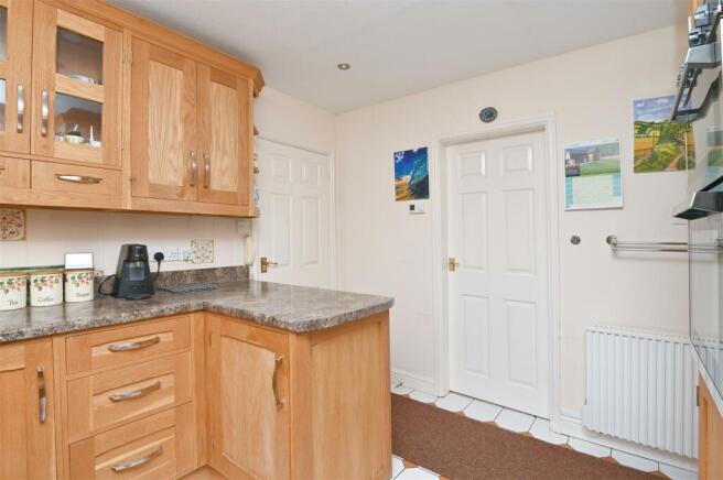 Kitchen towards utility and hallway.jpg