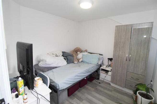 Bright bedroom with ample storage and desk spac...