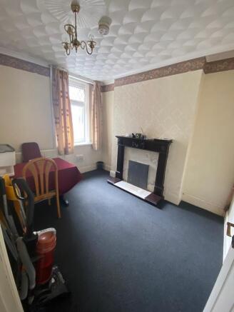 Bright living space with classic fireplace...