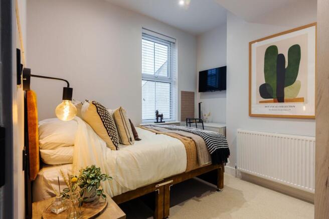 Cosy double bedroom with stylish decor...