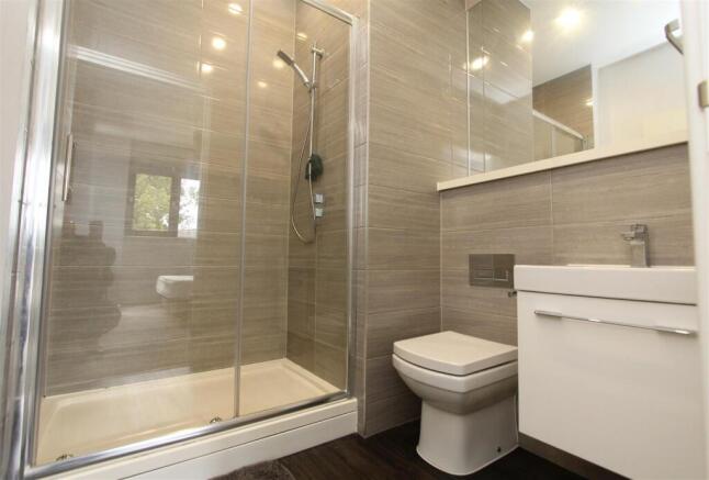 Modern bathroom with stylish tiles and shower....