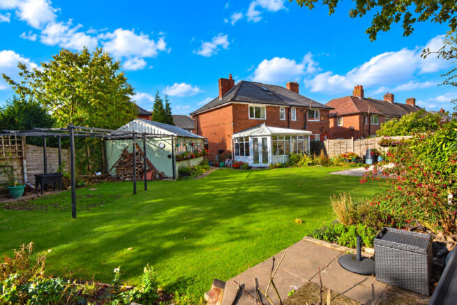 Bright Suburban Garden with Conservatory