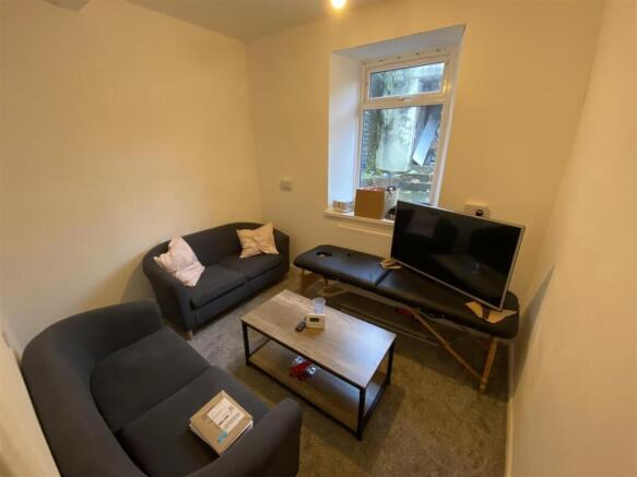 Cosy lounge featuring modern sofas and coffee t...