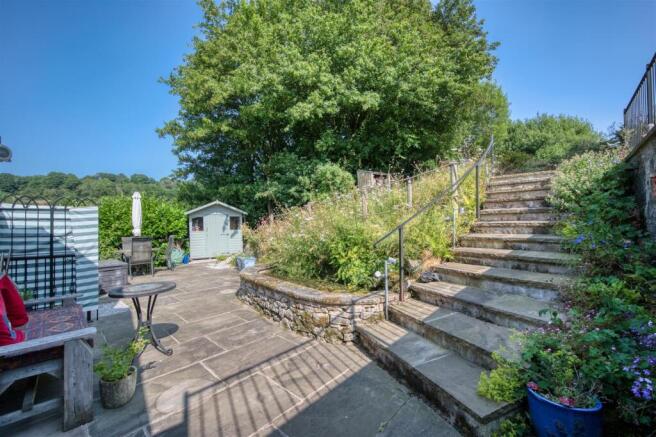 Garden - dining patio, pond and steps.jpg