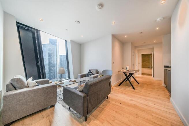 Bright modern living area with stunning city vi...