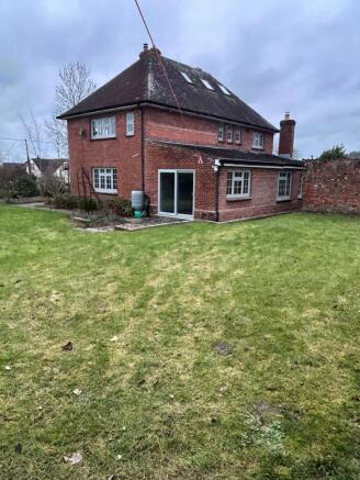 Garden with patio and background
