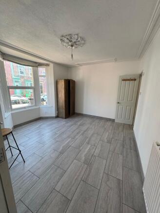 Spacious bedroom with bright bay window...