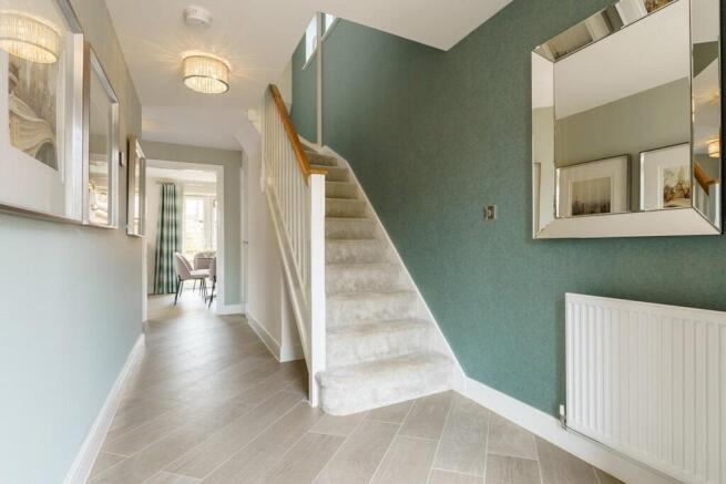 Bright and spacious hallway with under stair storage