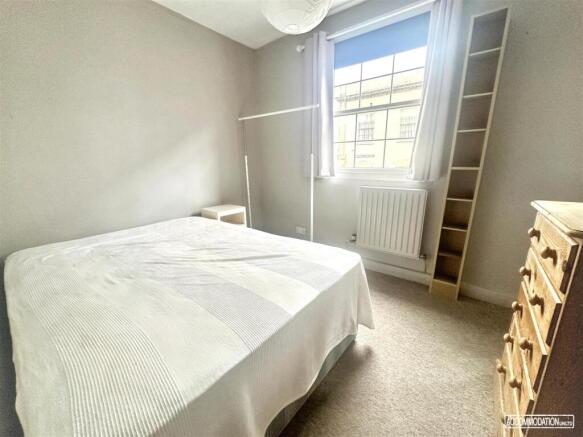 Bright double bedroom with large window...