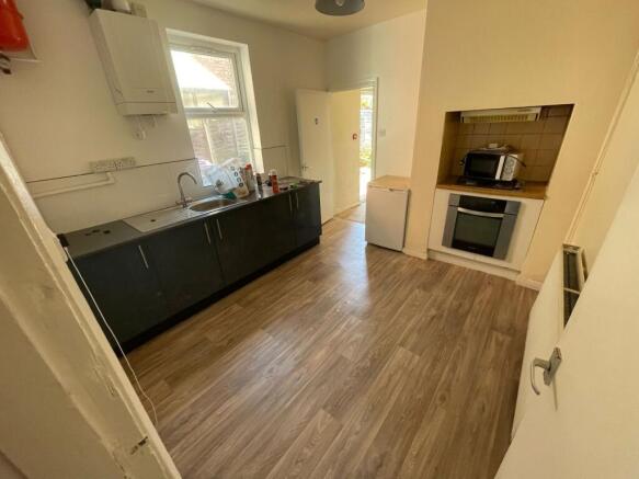 A neat and functional kitchen featuring modern ...