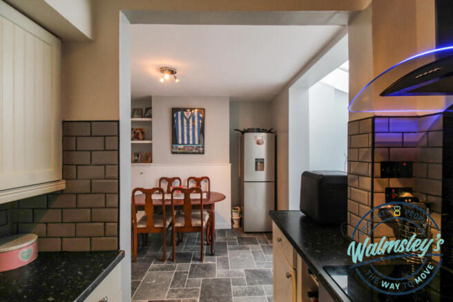 Kitchen with dining room beyond