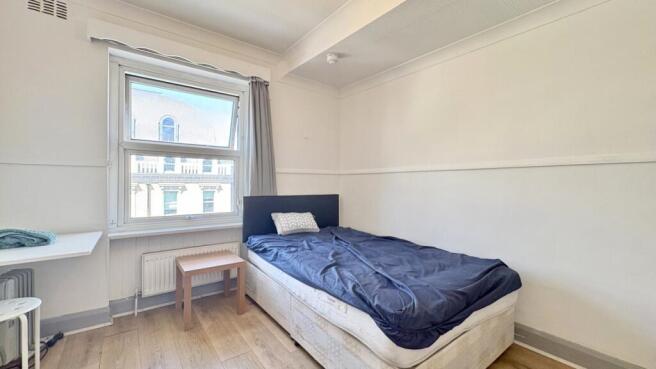Bright and airy bedroom with modern wood floors...
