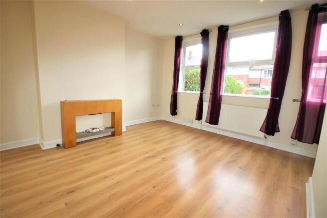 Bright living room with sleek wood floors....