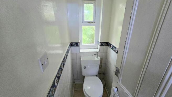 Bright, clean WC with a modern toilet, natural ...