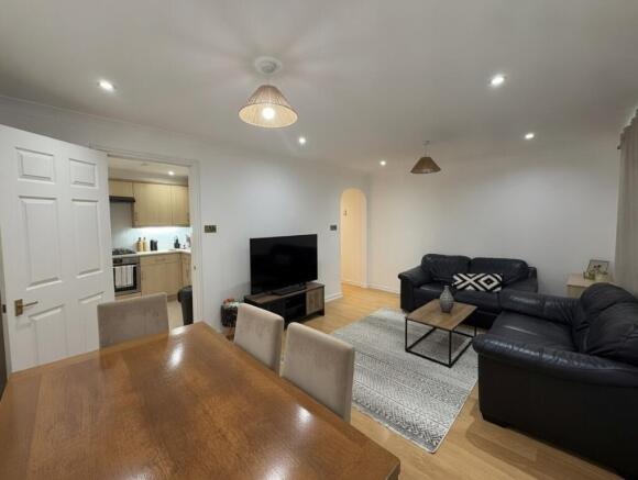 Bright lounge with dining area and modern seati...