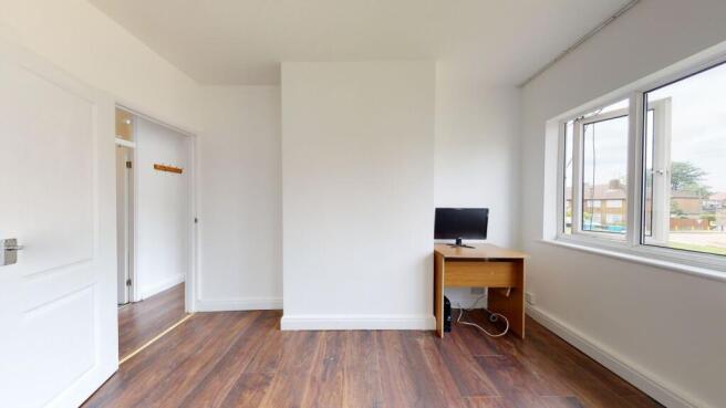 Bright room with large window and study desk...