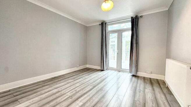 Bright spacious room with French patio doors...