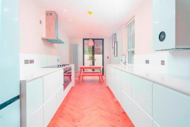 Modern, bright kitchen with dining area...