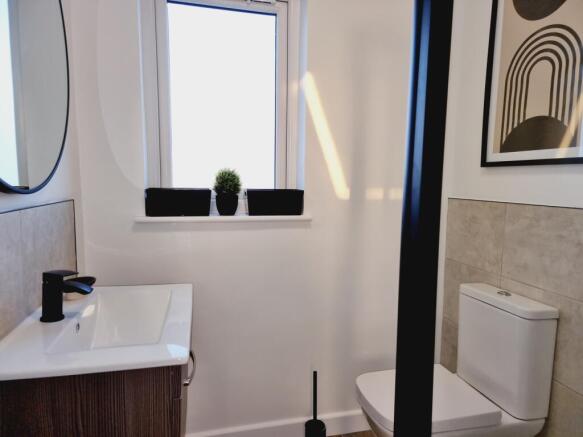 A modern bathroom featuring a sleek design with...