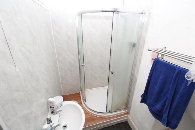 Bright bathroom with modern corner shower cubic...