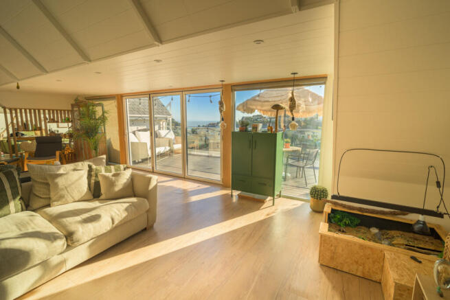LIVING ROOM VIEW TO BALCONY AND SEA VIEW