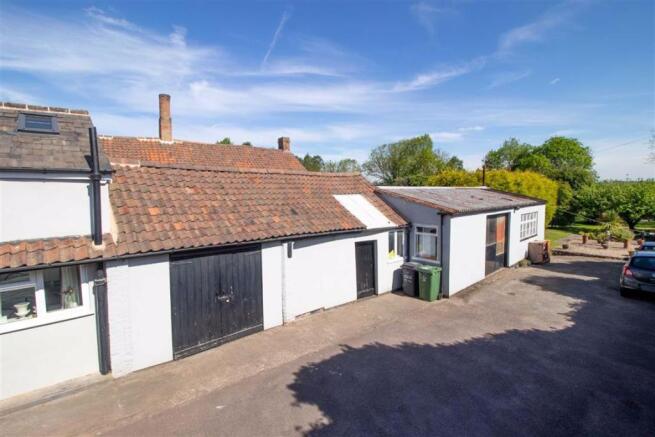 PARKING AREA AND OUTBUILDINGS