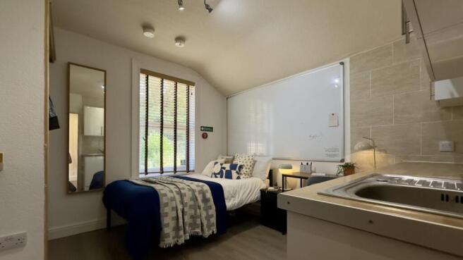 A bright and inviting double bedroom, perfect f...