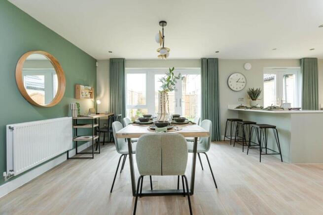 Double doors lead from the dining area to the garden, perfect for al fresco dining