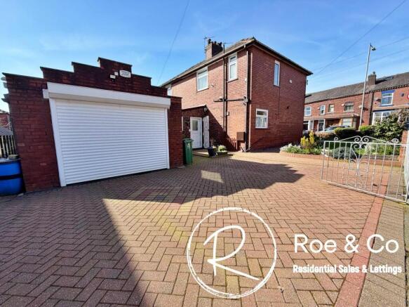 The garage & side of the property