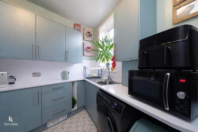 Modern kitchen with geometric floor tiles.jpg