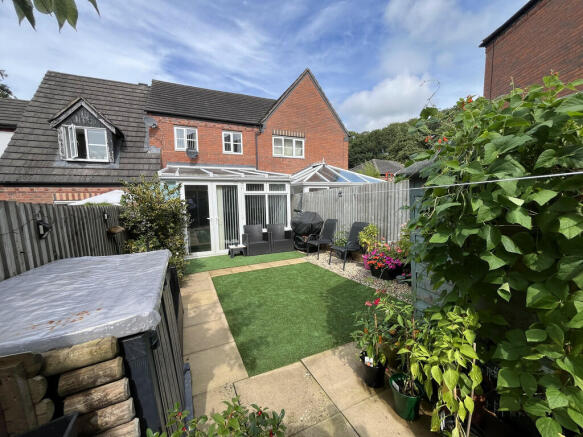 Rear garden to ex...