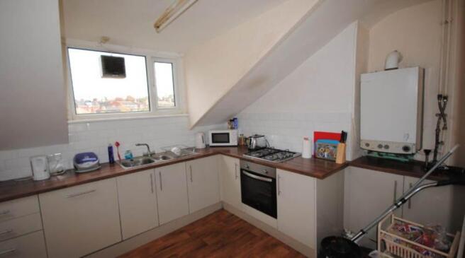 Bright and functional kitchen area with ample c...