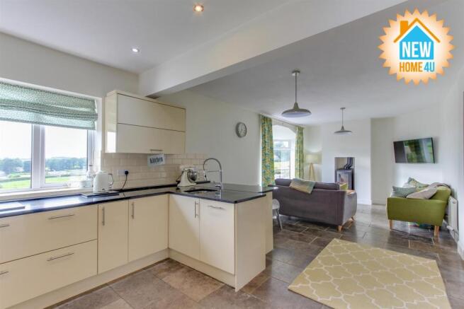 KITCHEN/DINING AREA/ FAMILY ROOM: