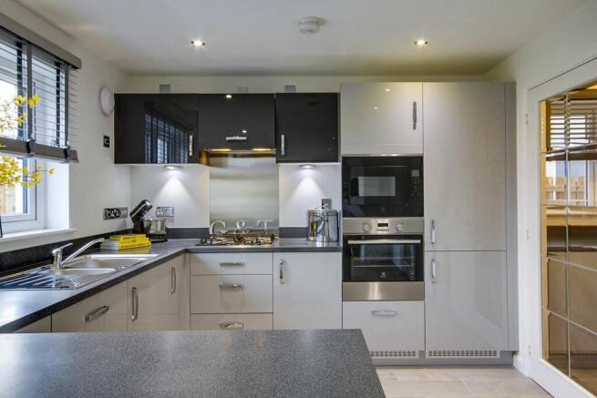 3 sided kitchen and utility room provides lots of storage