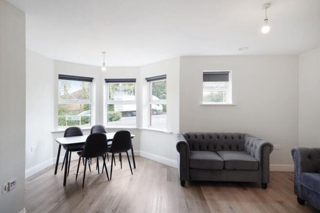 Bright, modern lounge with stylish bay window...