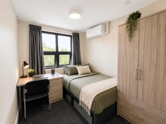 Modern room with study desk and ample storage...